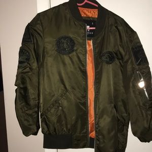 Green embroidered bomber jacket.